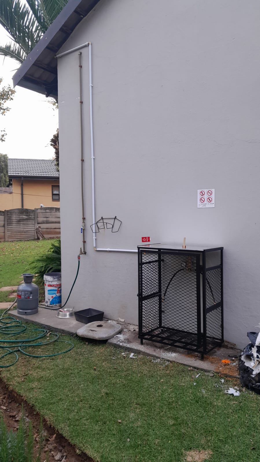 Outdoor patio gas braai pipe reticulation line installed on external wall in Gauteng